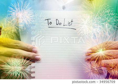 man in white shirt hold paper to do list man in white shirt hold paper to do list 34956709