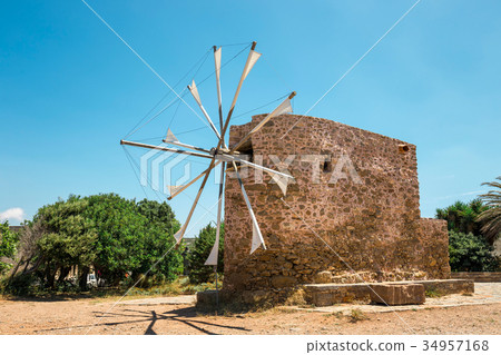 Old stone windmill, Crete island in Greece Old stone windmill, Crete island in Greece 34957168