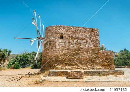 Old stone windmill, Crete island in Greece Old stone windmill, Crete island in Greece 34957185