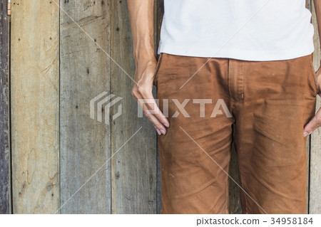 Close up man standing with wood pattern background Close up man standing with wood pattern background 34958184