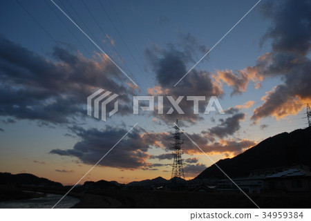 Spring evening, blue sky and clouds illuminated by sunset 34959384