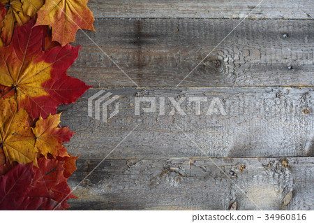 Autumn leaves frame on wooden background Autumn leaves frame on wooden background 34960816