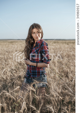 Beautiful girl in brunette field, with long Beautiful girl in brunette field, with long 34960917
