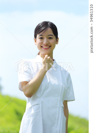 Nurse doing a guts pose 34961310