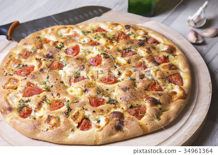 Fresh bread focaccio with cheese and tomatoes Fresh bread focaccio with cheese and tomatoes 34961364