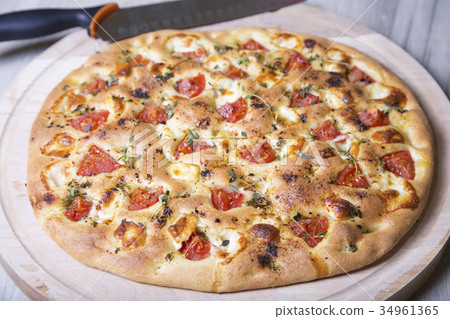 Fresh bread focaccio with cheese and tomatoes Fresh bread focaccio with cheese and tomatoes 34961365