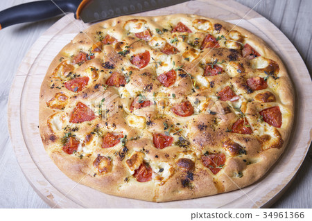 Fresh bread focaccio with cheese and tomatoes Fresh bread focaccio with cheese and tomatoes 34961366