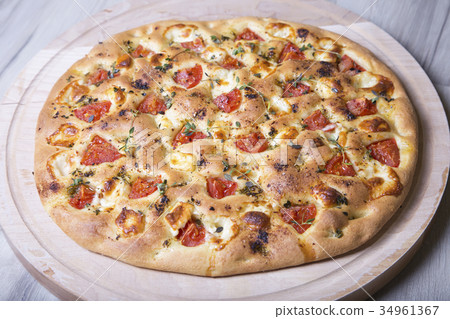 Fresh bread focaccio with cheese and tomatoes Fresh bread focaccio with cheese and tomatoes 34961367
