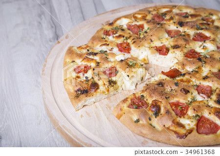 Fresh bread focaccio with cheese and tomatoes 34961368