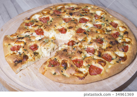 Fresh bread focaccio with cheese and tomatoes Fresh bread focaccio with cheese and tomatoes 34961369
