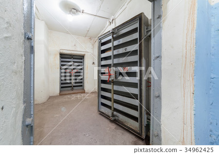 Heavy steel door in the bomb shelter Heavy steel door in the bomb shelter 34962425