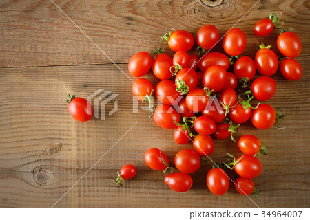 Red fresh tomatoes on wooden table. Red fresh tomatoes on wooden table. 34964007