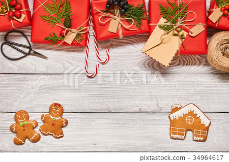Christmas presents on wooden background Christmas presents on wooden background 34964617