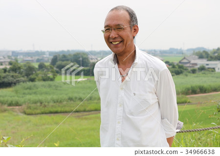 Senior man looking from the top of the hill Senior man looking from the top of the hill 34966638