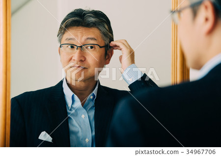 Middle men getting dressed 34967706