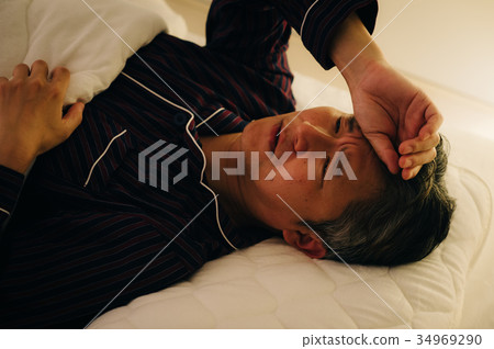 Sleepy senior man not feeling well 34969290
