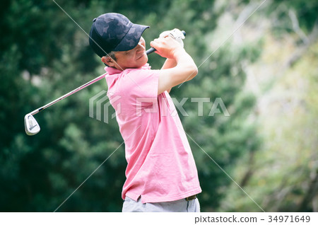 Middle men playing golf 34971649