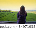 Woman tourism sitting on wood balcony to see view 34971938
