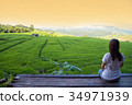 Woman tourism sitting on wood balcony to see view 34971939