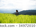 A woman, tourism enjoy on beautiful rice field 34972010