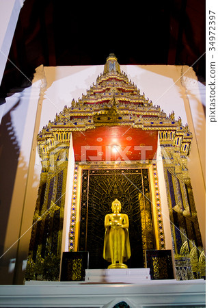 Golden buddha statue at night Golden buddha statue at night 34972397
