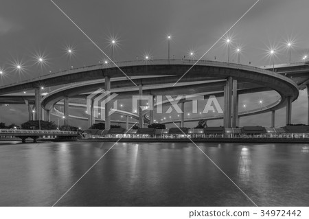 Night highway intersection water front 34972442