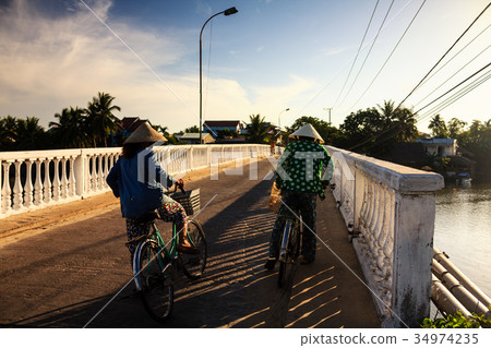 Two local women are on the way to local market Two local women are on the way to local market 34974235