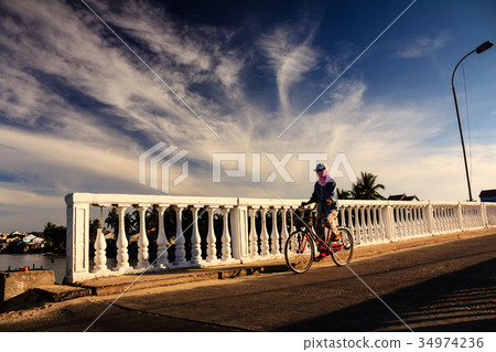 A local woman is on the bridge, Quang Nam A local woman is on the bridge, Quang Nam 34974236