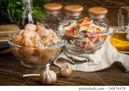 Raw chicken fillet breast cut into pieces. Raw chicken fillet breast cut into pieces. 34974476