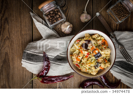 Risotto with chicken and vegetables. Risotto with chicken and vegetables. 34974478