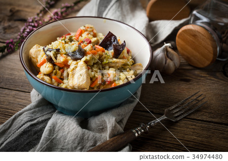 Risotto with chicken and vegetables. Risotto with chicken and vegetables. 34974480