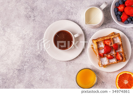 Delicious breakfast on a light table. Delicious breakfast on a light table. 34974861