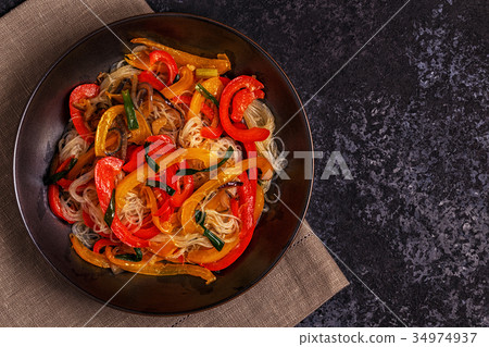 Cooking asian stir fry noodles with vegetables Cooking asian stir fry noodles with vegetables 34974937