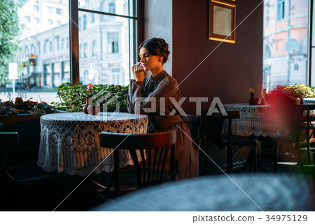 Young beautiful retro lady in cafe Young beautiful retro lady in cafe 34975129