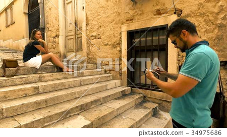 Young couple making photos on narrow Mediterranean 34975686
