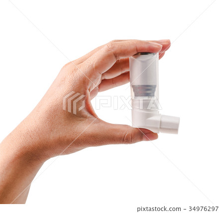 Hand holding asthma inhaler. 34976297