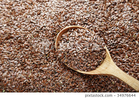 Flax seeds scattered Flax seeds scattered 34976644