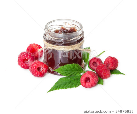 Raspberries jam in glass jar and berries Raspberries jam in glass jar and berries 34976935