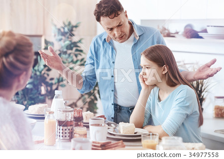 Concerned father getting emotional while yelling 34977558