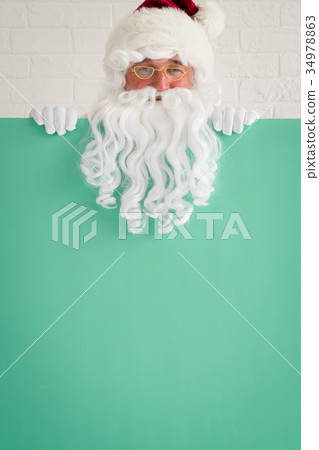 Santa Claus holding banner blank Santa Claus holding banner blank 34978863