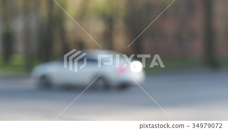 blurred background of traffic in town at daytime blurred background of traffic in town at daytime 34979072