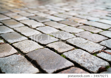 wet old granite pavement closeup wet old granite pavement closeup 34979271