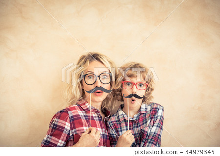 Happy family playing in home Happy family playing in home 34979345
