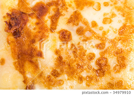 Pancake stuffed with ham and cheese. 34979910