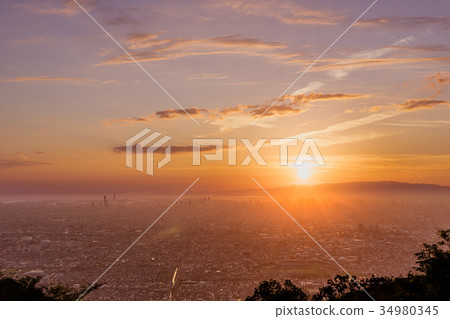 Mt. Ikoma, the sunset over Osaka seen from "Our Square" (Kamishijo-cho, Higashi-Osaka City, Osaka Prefecture) *Photo location information in the comment section 34980345