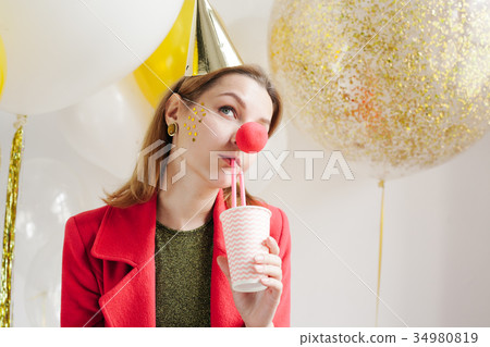woman at a party on the background of balloon 34980819