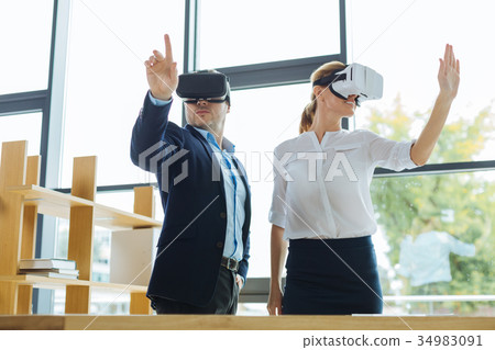 Joyful positive colleagues working together 34983091
