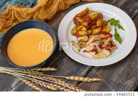 Fried potato with meat and pumpkin soup Fried potato with meat and pumpkin soup 34983721