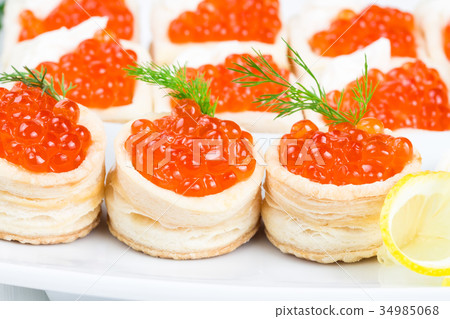 Tartlets with red caviar 34985068