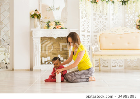 Smiling Mother Playing With Mixed Race Baby Son At 34985895